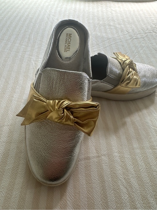 Michael Kors Shoes - Michael Kors Metallic Silver Slip-On Mules with Gold Bow